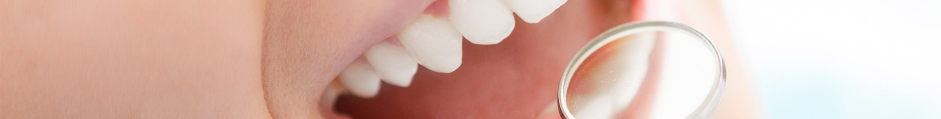 Close-up of woman having her teeth examined